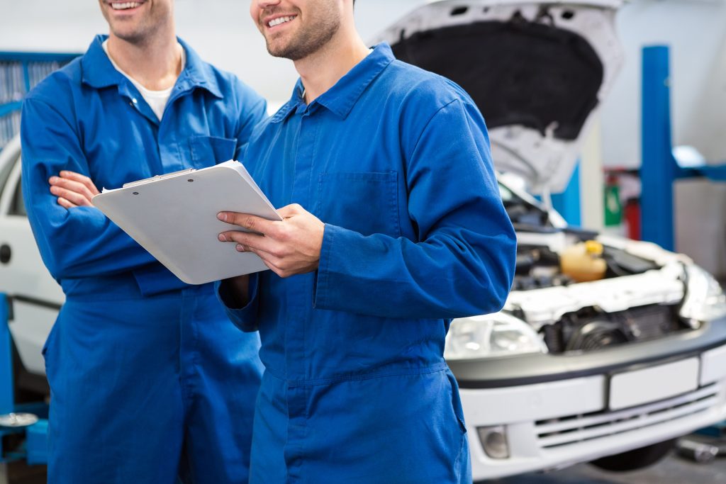 bigstock Smiling mechanic working toget 81269978 2